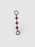 Flora chain strap extender by Rivolla — delicate triple floral link detail in porcelain, black and sienna