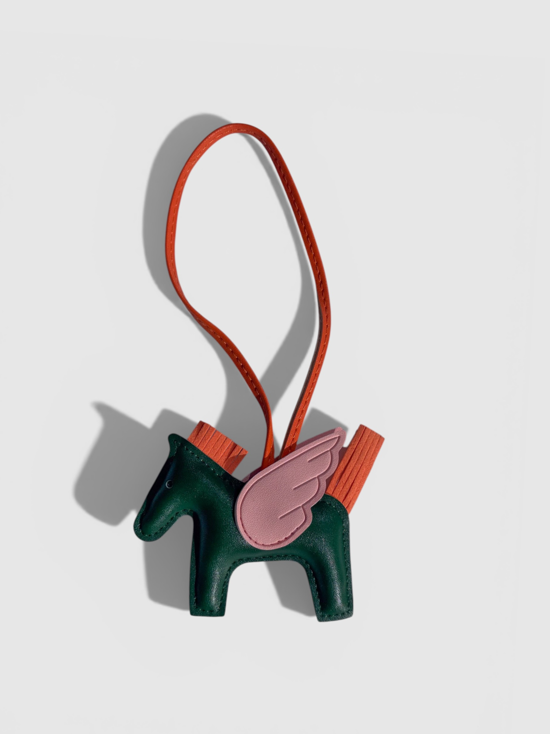 Pegasus leather bag charm by Rivolla — smooth leather horse with contrast wing and tassel mane detail